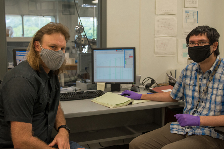 From left, Jeremy Owens, an associate professor in the Department of Earth, Ocean and Atmospheric Science, and Sean Newby, a graduate research assistant, analyzing thallium isotopes on instruments at the National High Magnetic Field Laboratory. (Stephen Bilenky / National High Magnetic Field Laboratory)