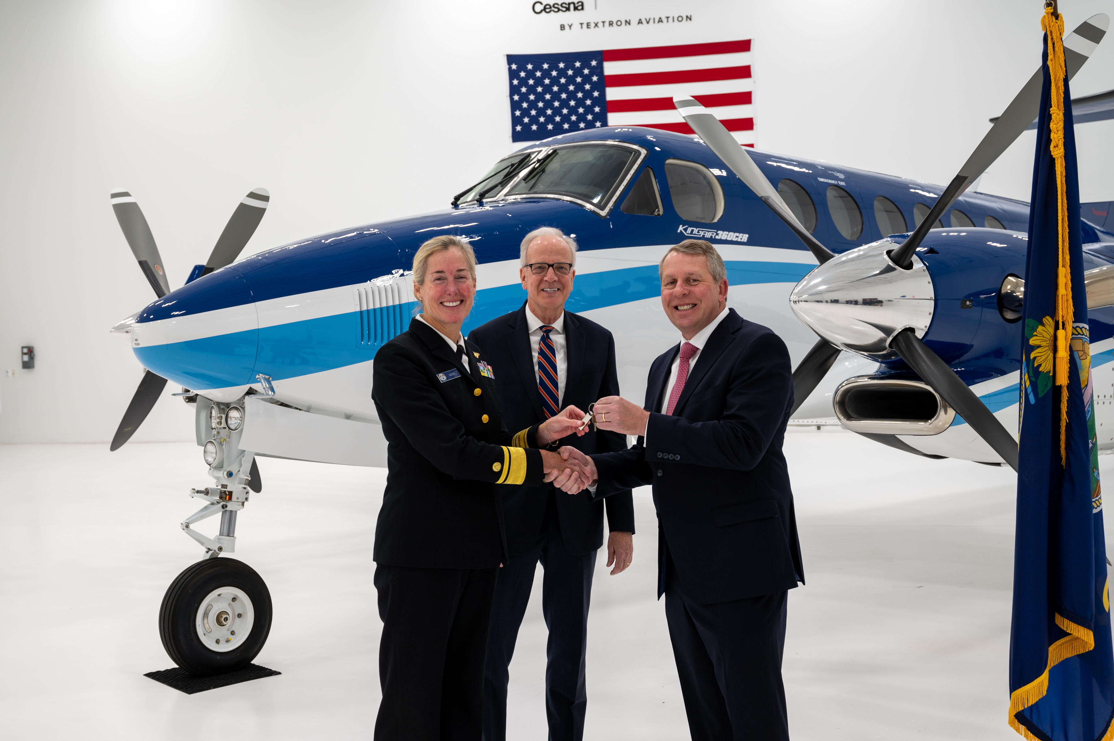 Image2 PHOTO RADM Hann conducts key exchange with Textron and Sen Jerry Moran 2023 Textron